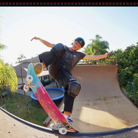 Skateboarder wearing Slim Knee Pad Black Medium With Fusion Groove Channel And Memory Foam For A Snug Dope Fit on ramp