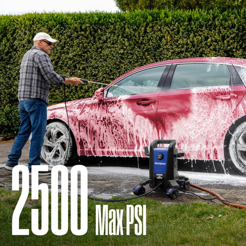 Man using Beast Electric Pressure Washer With 2500 Max PSI And 1.76 GPM Anti Tip Tech on car covered in soap