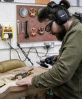 Man wearing Noise Isolating Bluetooth Earmuffs for Worksite, Boss Level Comfort, memory foam, 24 dB NRR noise reduction, woodworking