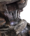 Close-up of 40-Inch Four Tier Rock Floor Fountain With Cascading Water And White LED Lights, outdoor water feature detail.
