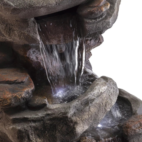 Close-up of 40-Inch Four Tier Rock Floor Fountain With Cascading Water And White LED Lights, outdoor water feature detail.