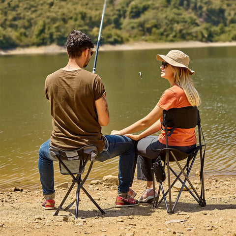 People sitting on Extra Large Quick Folding Tripod Stool With Backrest For Fishing And Camping Built Tough at a lakeside