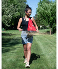 Person using Hand Held 25 Pound Bag Seeder Spreader for Lawn Care, Grass Seed Spreader for Spot Seeding in Small Areas on green lawn