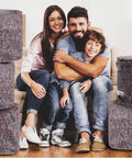 Family with 32 Piece Bulk Moving Blankets 54 By 72 Inch Heavy Duty Furniture Pads For Protecting Floors And Furniture During Moves Storage And Shipping Ideal Packing Blanket Set Brown Budget Friendly Easy To Use For Home Movers visible in the background