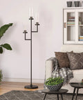 Living room with Three Light Torchiere Floor Lamp With Glass Shades In Blackened Bronze And Clear Finish near sofa