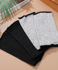 Real Deal Cut Resistant Arm Sleeves For Mechanics And Gardeners With Snug Stretch Fit Anti Puncture Forearm Guards That Make The Daily Grind A Total Breeze In Black Gray laid out on a surface.
