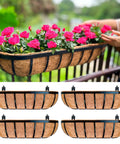 Four Pack Twenty Four Inch Black Metal Railing Planter Boxes With Natural Coco Fiber Liner And Heavy Duty Adjustable Clamps For Quick No Sweat Deck Fence Balcony Patio Garden, featuring pink flowers on a railing.
