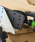 Person using Ergonomic Hand Sanding Block With Easy Grip Handle And Suction Bypass For Precise 80 mm By 133 mm Sandpaper Fits No Surface Damage From Rounded Corner Design For Pro Grade Woodworking to attach sandpaper