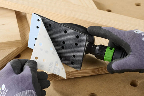 Person using Ergonomic Hand Sanding Block With Easy Grip Handle And Suction Bypass For Precise 80 mm By 133 mm Sandpaper Fits No Surface Damage From Rounded Corner Design For Pro Grade Woodworking to attach sandpaper