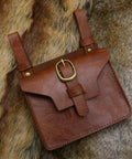 Easy Adjust Vintage Brown Leather Waist Belt With Heavy Duty Industrial Buckle Dope Gritty Look For Larp Cosplay Historical Party Props And Weekend Kickbacks Built Solid Perfect Fit, displayed on fur background.