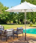 Heavy Duty 50 Lb Patio Umbrella Base Portable Outdoor Stand With 24 Inch Square Holder in a poolside patio setup