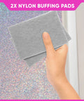 Hand holding two buffing pads in front of a glittery wall background for use with Glitter Paint Additive 5.3oz with 2 Buffing Pads