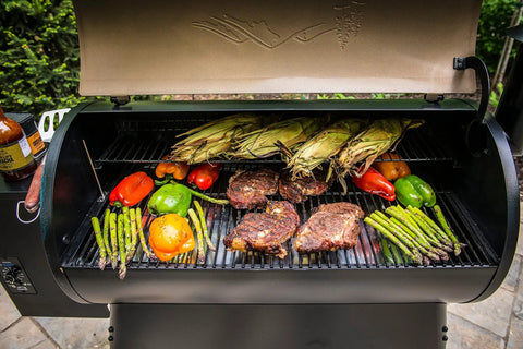 Wood Pellet Grill And Smoker That Delivers Wood Fired Flavor With Big 884 Square Inches Cook Area And Bronze Finish 450 Degree Max Meat Probe 6 In 1 Versatility For Smokin Grilling Baking Roasting Braising And Searing loaded with vegetables and meat