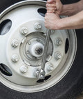 Using Three Quarter Inch Drive Hinge Handles With Ball Detent For Secure Socket Retention on vehicle wheel lug nuts