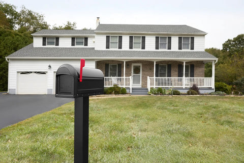 Heavy Duty Metal Post Mounted Mailbox In Black For Outside, Weatherproof Steel Construction, Rust Resistant Finish, Large Curbside Mailbox With Magnetic Latch, Durable Home Mailbox For Rain Snow Sun in front of a house