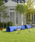 Dogs enjoying 7 Piece Dog Agility Training Kit with tunnels, weave poles, adjustable hurdles, jump ring, in backyard.