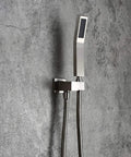 Heavy Duty Brushed Nickel Wall Mount Shower Combo Features A Square Ten Inch Ceiling Rain System And Handheld Spray Unit Crafted From Solid Brass For Knockout Water Pressure On Your Daily Grind - Close-up of handheld sprayer on wall