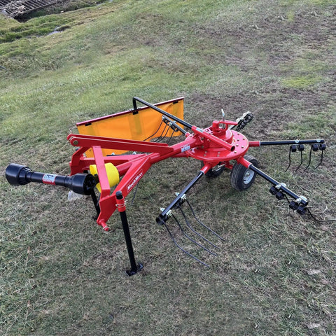 All In One Hay Baler And Rake Tedder Disc Mower Combo HB3120 HT100 DM6 with intricate tines and robust frame on grassy field