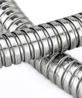 Close-up of metal coil spring resembling the Ultra Lightweight 100 Ft Garden Hose With No Tangle Anti Kink Design For Quick Watering.