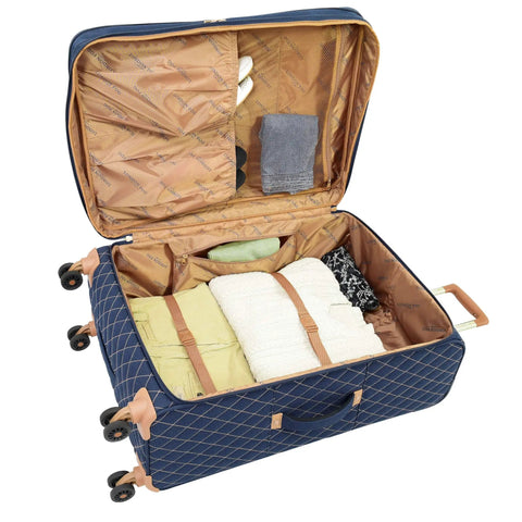 Open suitcase from Queensbury 4 Piece Luggage Set Navy showing interior with items and quilted polyester material.