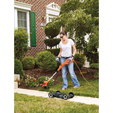 Person using 3-In-1 Electric Lawn Mower, Trimmer And Edger With 6.5 Amp Motor, 12 Inch Cutting Width in yard