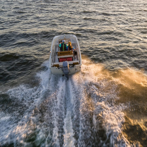 Boat on water using Universal Outboard Fuel Line Kit With 7 Foot 3 Eighth Inch Hose UV Resistant EPA CARB Compliant Primer Bulb Connectors