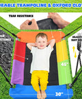 Child lying on a colorful 45x30 inch swing with tear-resistant and water-resistant Oxford cloth, part of a heavy duty backyard swing set for kids up to 440 lbs with toddler swing belt swing and platform swing triple outdoor metal frame easy to assemble sturdy A frame playground gear.