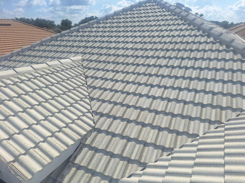 Heavy Duty Tile Roof Glaze And Clear Shielding Sealant With Urethane Reinforced Strength For Tough As Nails Weather Barrier And A Sleek Satin Finish That Gonna Save Your Tiles From Failing In A Practical Five Gallon Size on a tiled roof.