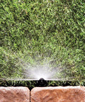 Reliable Half Circle Lawn Spray Nozzle With Adjustable 8 To 15 Feet Reach spraying water over grass with a durable design.