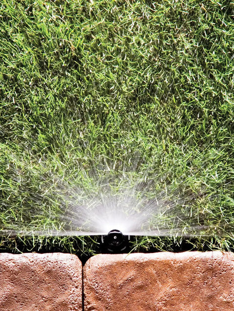 Reliable Half Circle Lawn Spray Nozzle With Adjustable 8 To 15 Feet Reach spraying water over grass with a durable design.