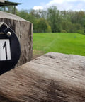 Genuine Leather Number Holders for Bridle or Saddle Pad two pack on wooden post with bling clip.