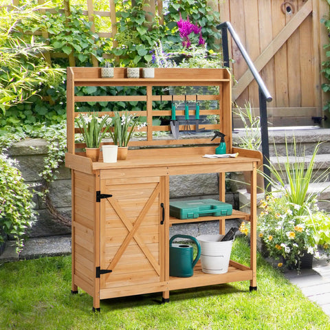 Large Outdoor Potting Bench With Storage Cabinet And Shelf Planting Console For Patio Lawn Garden Pro Grade Fir Wood Workstation Built To Last Durable Finish And Easy Assembly on grass with garden tools and potted plants