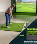 Man practicing swing on Golf Hitting Mat 5x4 Ft with Premium 15 Mm Artificial Turf, indoor setup shown with screen