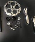 44T Wide Crank Assembly Kit for Gas Motorized Bicycle, 3 Piece Set, components displayed on black surface