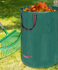 Adjustable Metal Leaf Rake Set With Telescopic Handle From Thirty Eight To Seventy Three Inches Twenty Five Tines Nineteen Inch Wide Includes Two 32 Gallon Leaf Bags And Scoops Heavy Duty Garden Rake For Lawns Shrubs Grass And Flower Beds displayed with leaf bag filled with orange leaves on lawn