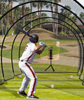 Player practicing in 40 Foot Batting Cage For Baseball And Softball With Sock Pocket Freestanding Frame Heavy Duty Net And Portable Backyard Training Gear For Freestyle Hitting And Practice