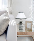 Shades Of Gray Ceramic Stacked Stone Table Lamp With Fabric Shade, 14.7 Inch Modern Bedside Light on glass end table next to sofa