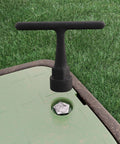 Curb Box Wrench For Pentagon Curb Boxes Grey Grab And Go Compact Easy Grip Tool inserted in a curb stop box on grass