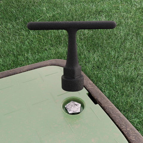 Curb Box Wrench For Pentagon Curb Boxes Grey Grab And Go Compact Easy Grip Tool inserted in a curb stop box on grass