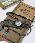 Advanced Compass Navigation Kit With Multifunction Case And Protective Map Pouch In Tan, showing open case with compass, notebook, and pens