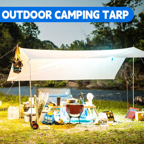 Outdoor setup with Heavy Duty 10X20 Ft White Tarp 12Mil Waterproof UV Resistant Multipurpose Sheet for camping by a river.