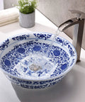 Blue and white porcelain vessel sink with water flowing from a faucet into the bowl