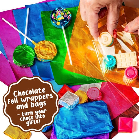 Colorful foil wrappers and candy bars from Totally Fun Chocolate Making Kit For Kids With Candy Bar Molds Lolly Sticks And Wrappers