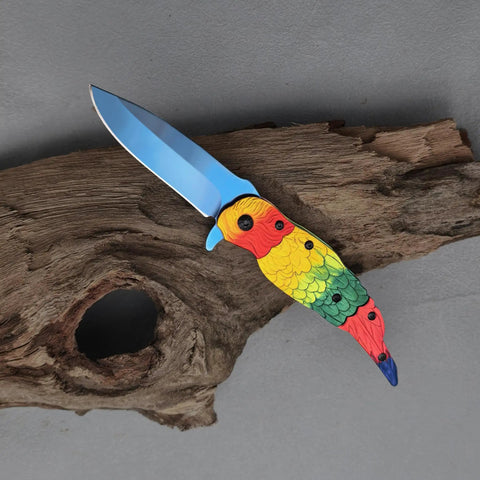 Colorful Parrot Pattern Folding Pocket Knife With Gradient Parrot-Scale Handle, 3-Inch Blue Coated Blade, on a wooden surface