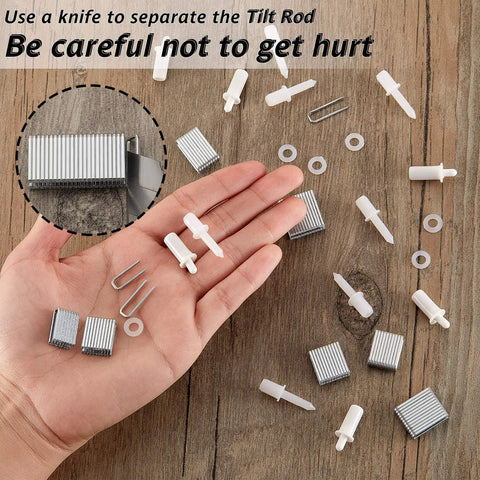 Hand holding pieces from All In One Plantation Shutter Repair Kit With 85 Pieces Sturdy Shutter Louvers Staples Repair Pins Spring Pins Collar Pins Mixed Sizes For Windows DIY Tools And Supplies on wood surface