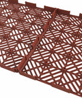 Close-up of terracotta deck tile surface, part of 30-Pack Interlocking Deck Tiles for Outdoor Flooring in Terracotta - Durable Weatherproof Polypropylene Patio Tiles for Balcony, Porch, and Garage With Easy Snap Installation.
