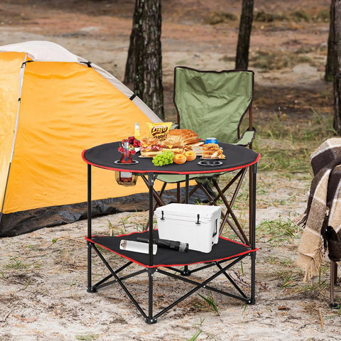 Portable Folding Picnic Table For Outdoors With 4 Cup Holders in camping setting with storage tier, sturdy steel frame.