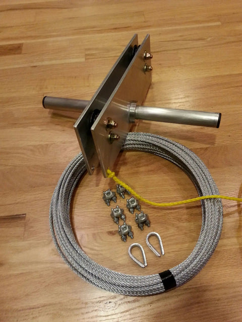 Backyard Zip Line Kit With 200 Feet Of Galvanized Cable And Aluminum Trolley For Epic Backyard Thrills, components on wood floor