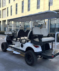 Electric Golf Cart With Reliable Lithium Battery And Built In Insulated Cooler White Four Plus Two Seater Rollin On 14 Inch Tires For Smooth Cruisin On The Greens Built Dang Tough For Work from side view