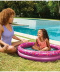 Child playing in a Minnie Mouse Kiddie Pool For Backyard Fun Inflatable Above Ground Pool With Easy Setup Durable Kid Friendly Pool Toy